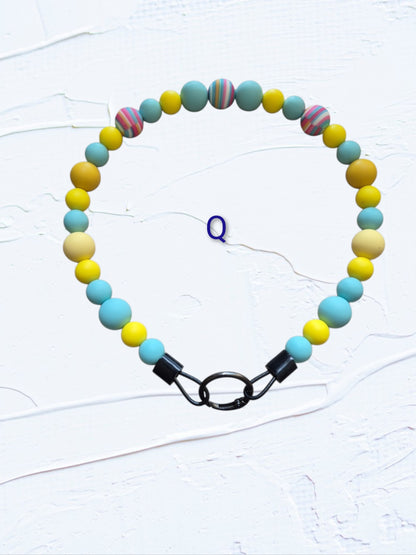 18 inch silicone beaded dog collars handmade in Canada – group shot showing Colour O in teal, navy, grey and white, Colour P in purple and lavender, and Colour Q in teal and yellow, with O-ring clasps