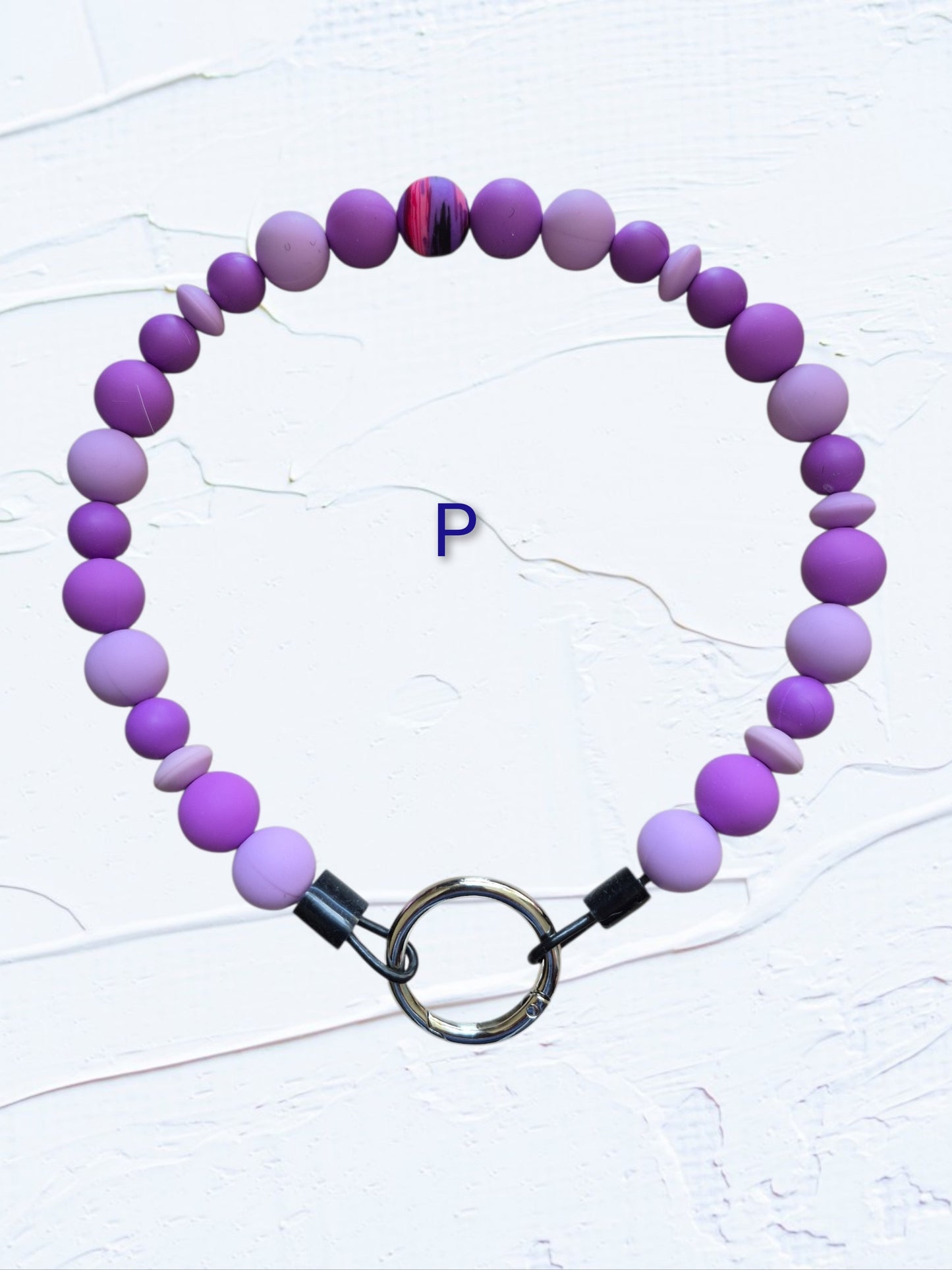 purple and lavender beads with multicolour swirl accent bead