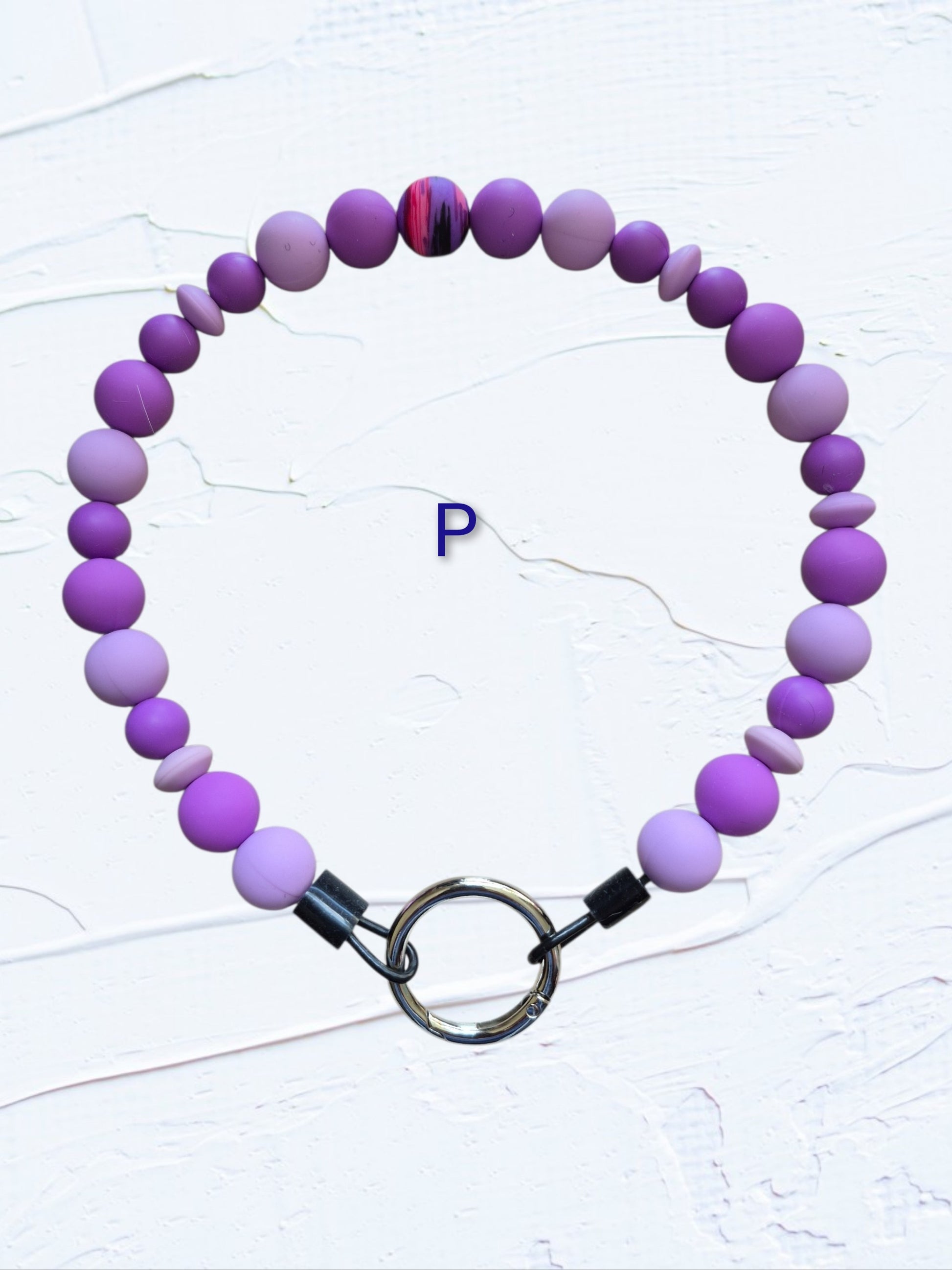 purple and lavender beads with multicolour swirl accent bead