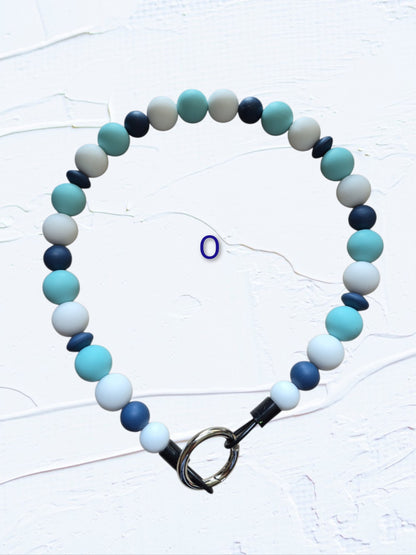 18 inch silicone beaded dog collar Colour O – teal, navy, grey and white beads with silver O-ring clasp, handmade in Canada